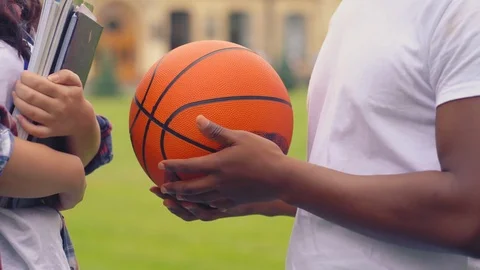 Two students standing and having cnversation Stock Footage 127307699