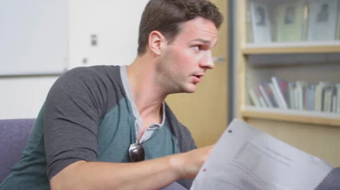 Two students talk about their notes in a study circle Vídeos de archivo 55119597