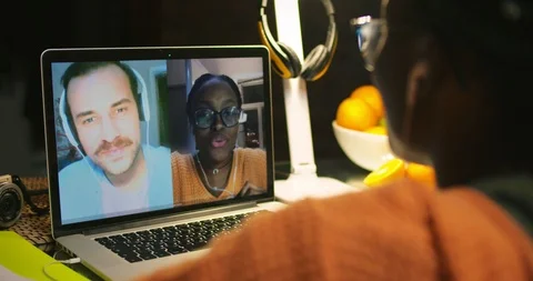 Two students talking via video chat and discussing their study Видео 99367481