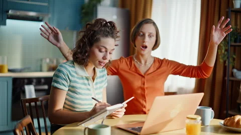 Two students talking webcam laptop having online conference home. Smiling girl Stock Footage 333793216