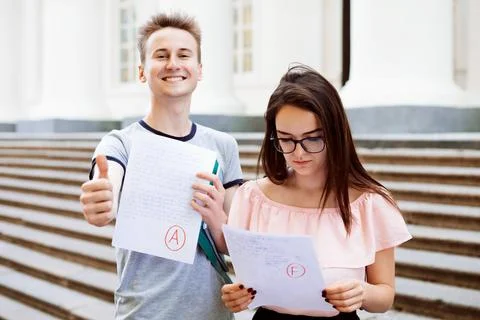 Two students with test results Stock Photos