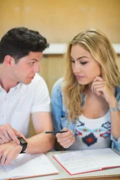 Two students timing their work Stock Photos