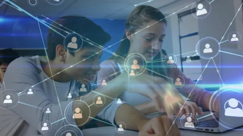 Two students typing and discussing in class, starting animated network forming Stock Footage 316186422