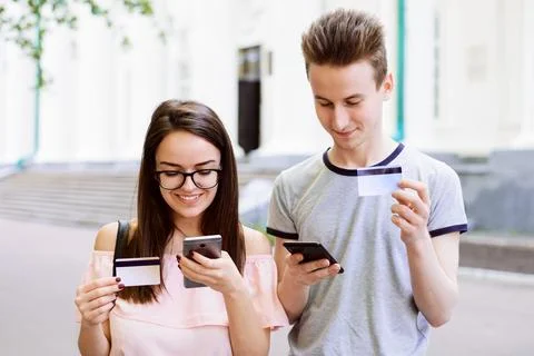 Two students using mobile phones Stock Photos