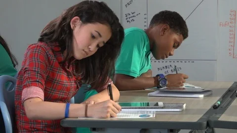 Two students working in classroom Stock Footage 99375408