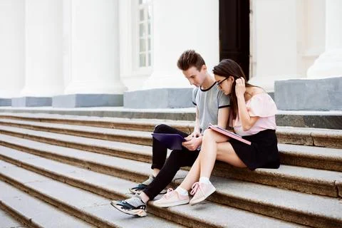 Two students working on project together Stock Photos