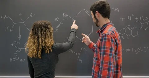 Two students working together collaborating and solving complex problems Stock Footage 106076356