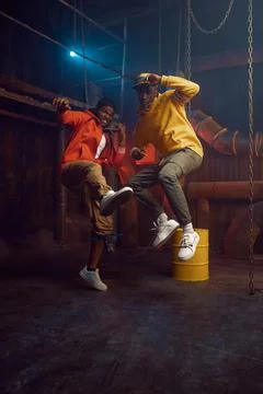 Two stylish rappers, breakdancing in studio Stock Photos