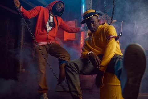 Two stylish rappers dancing in studio Stock Photos