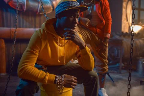 Two stylish rappers posing in studio Stock Photos