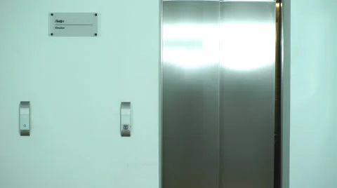 Two successful businessman out of the Elevator Stock Footage 67495094