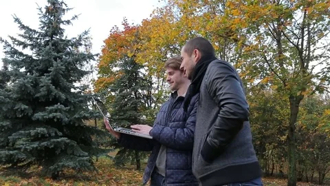 Two successful man discuss project using computer mobile internet 4G 3G 5G WIFI Stock Footage 73905078
