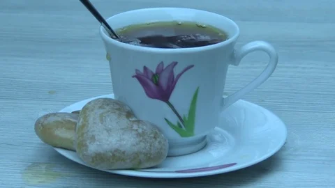 Two sugar cubes fall in tea Video stock 80797618