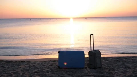 Two suitcases on the beach Stock Footage 74174732