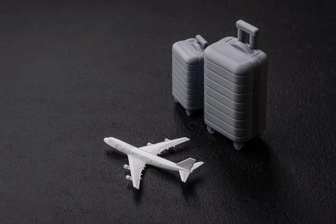 Two suitcases on a black background representing the concept of travel, emi.. Stock Photos