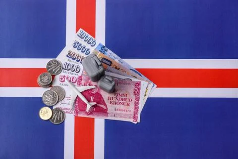 Two suitcases on a Iceland flag representing the concept of travel, emigrat.. Stock Photos