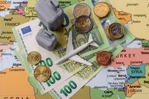 Two suitcases on a map of Europe representing the concept of travel, emigra.. Stock Photos