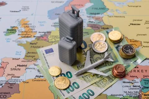 Two suitcases on a map of Europe representing the concept of travel, emigra.. Stock Photos