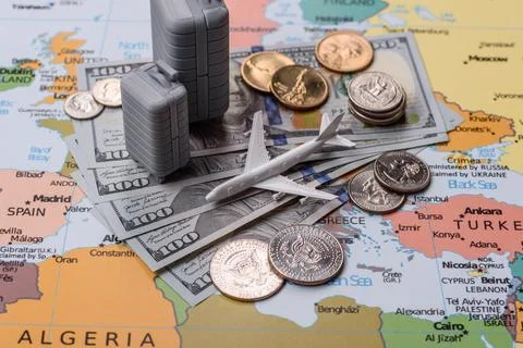 Two suitcases on a map representing the concept of travel, emigration, or a.. Stock Photos