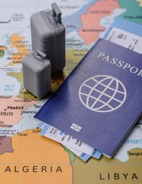 Two suitcases on a map representing the concept of travel, emigration, or a.. Stock Photos