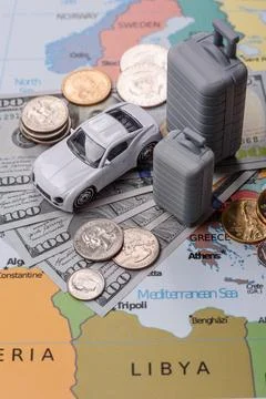 Two suitcases on a map representing the concept of travel, emigration, or a.. Stock Photos