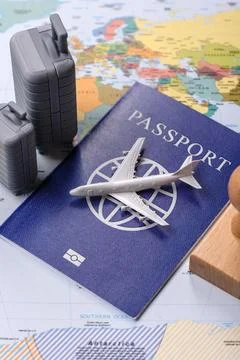 Two suitcases on a map representing the concept of travel, emigration, or a.. Stock Photos
