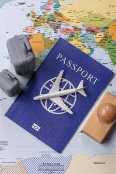 Two suitcases on a map representing the concept of travel, emigration, or a.. Stock Photos