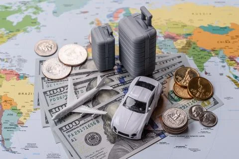 Two suitcases on a map representing the concept of travel, emigration, or a.. Stock Photos