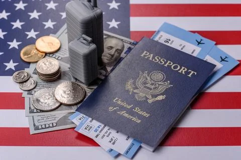 Two suitcases on a USA flag representing the concept of travel, emigration,.. Stock Photos