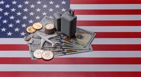 Two suitcases on a USA flag representing the concept of travel, emigration,.. Stock Photos