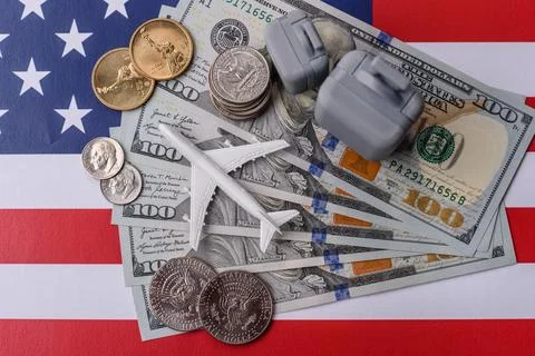 Two suitcases on a USA flag representing the concept of travel, emigration, o Stock Photos