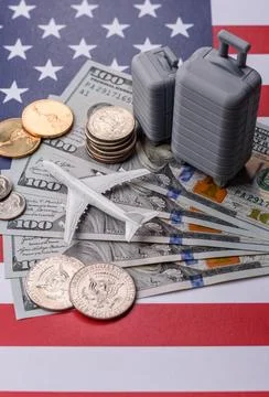 Two suitcases on a USA flag representing the concept of travel, emigration,.. Stock Photos