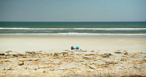 Two sunbeds on a beach in Florida 스톡 동영상 208229257