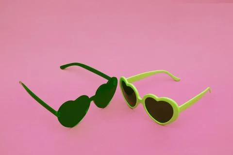 Two sunglasses on a pink background. 写真素材