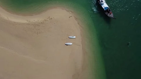 Two SUP boards lie on the coast of a tropical island, top view of paddle boards Stock Footage 170598467
