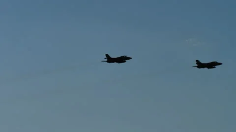 Two supersonic jet planes fly up in sunny sky outdoors on show Stock Footage 163261264
