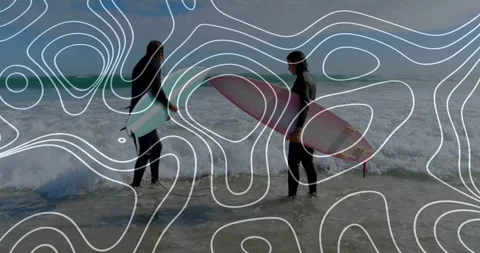 Two surfers adjusting boards stepping into breaking surf for surfing as waves Stock Footage 331287176