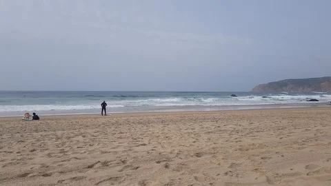 Two surfers on the beach are resting 動画素材 103205435