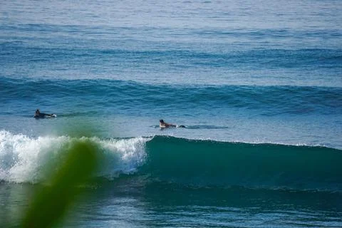 Two surfers on empty line up in the ocean close to Mirissa Stock Photos