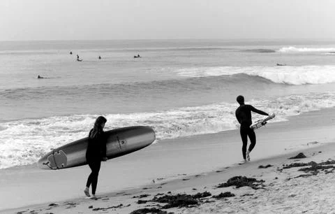 Two Surfers Headed to the Waves Stock-Fotos