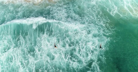 Two surfers paddling after a wave, drone, 4k 25FPS, NSW, Australia Stock Footage 102358894