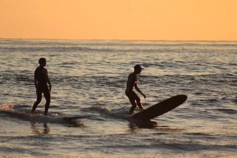 Two Surfers at Sunset Foto stock