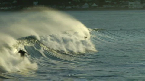 Two Surfers Try To Keep With Wave Stock-Footage 346650