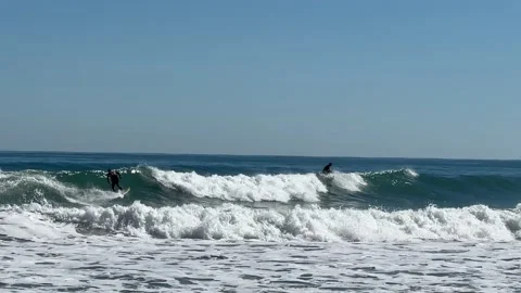Two Surfers Wipe Out Stock Footage 230343820