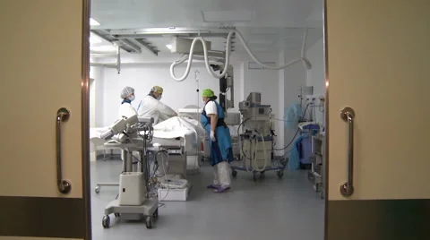 Two surgeons and a nurse doing heart surgery . Stock-Footage 62901181