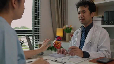 Two surgeons are sitting in their office discussing an upcoming major heart surg Stock Footage 296747801