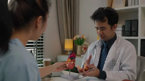 Two surgeons are sitting in their office discussing an upcoming major heart surg Stock Footage 296747817