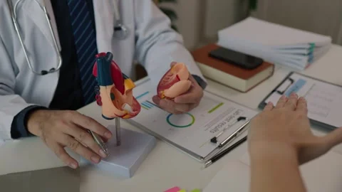 Two surgeons are sitting in their office discussing an upcoming major heart surg Stock Footage 296747972