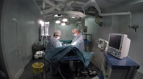 Two Surgeons during operation in operatig room. Stockbeeldmateriaal 49116737