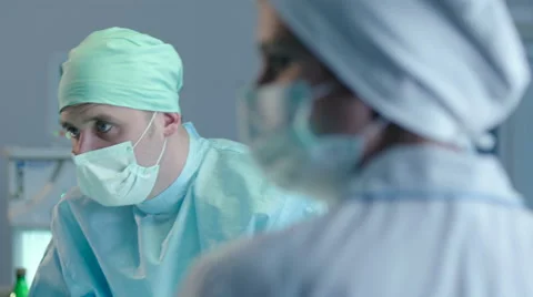 Two Surgeons Opetaring a Patient Stock Footage 59061534